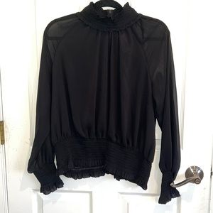 Sheer black blouse